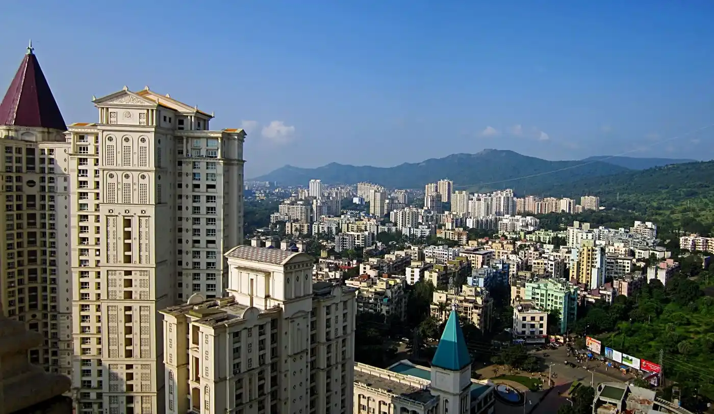 Thane West residential area showing premium gated community apartments and lush green landscape